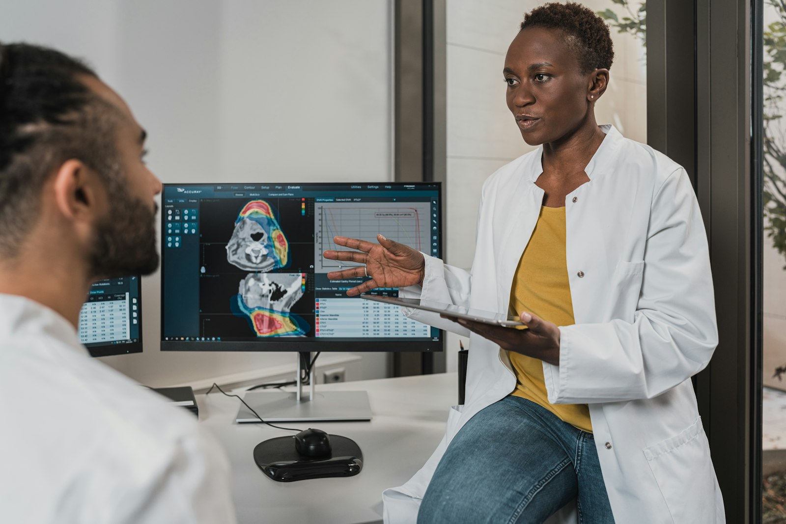 Physician discussing imaging with a patient — illustrative.